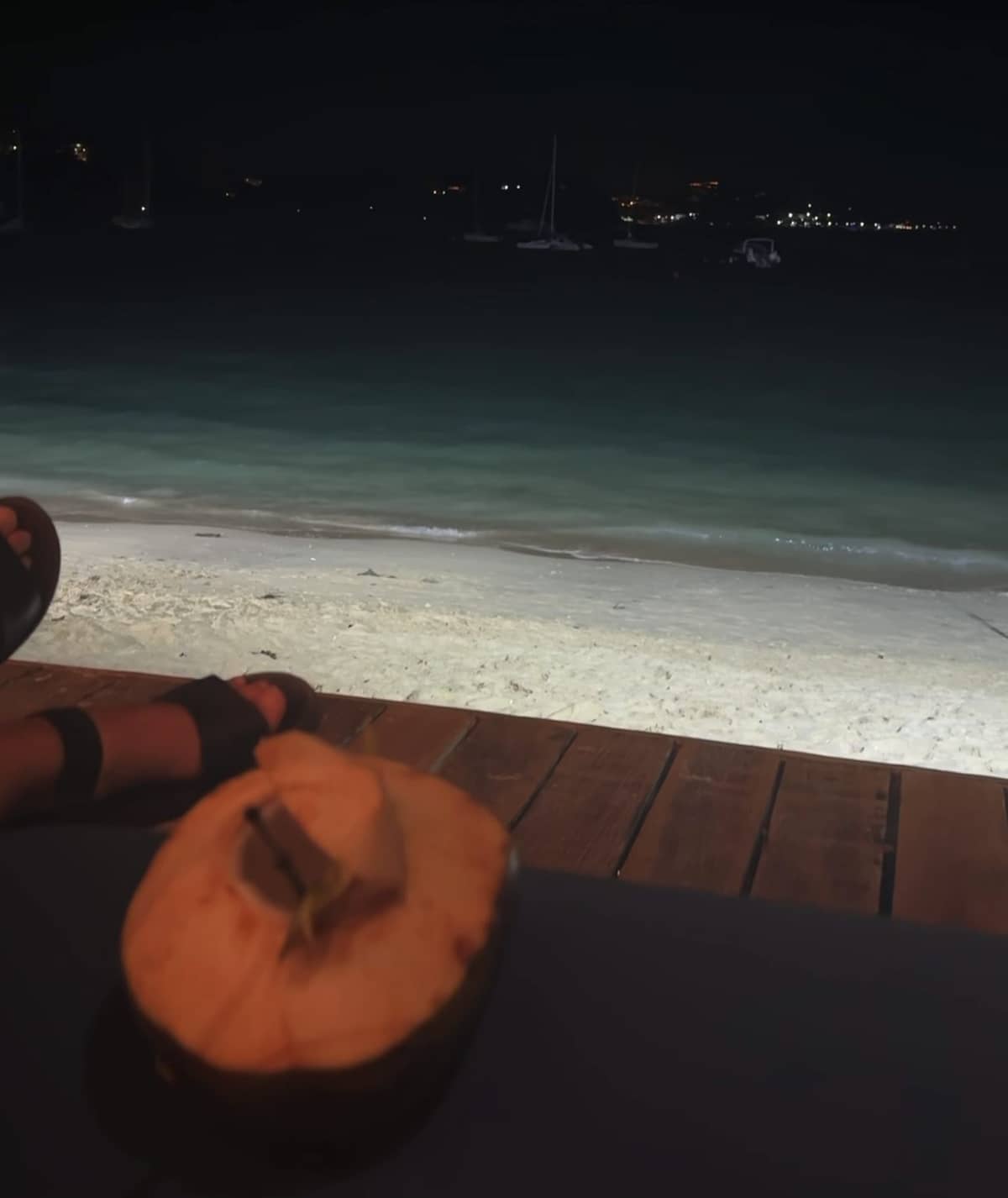 The beach at night, dark sand and the sea, no one around