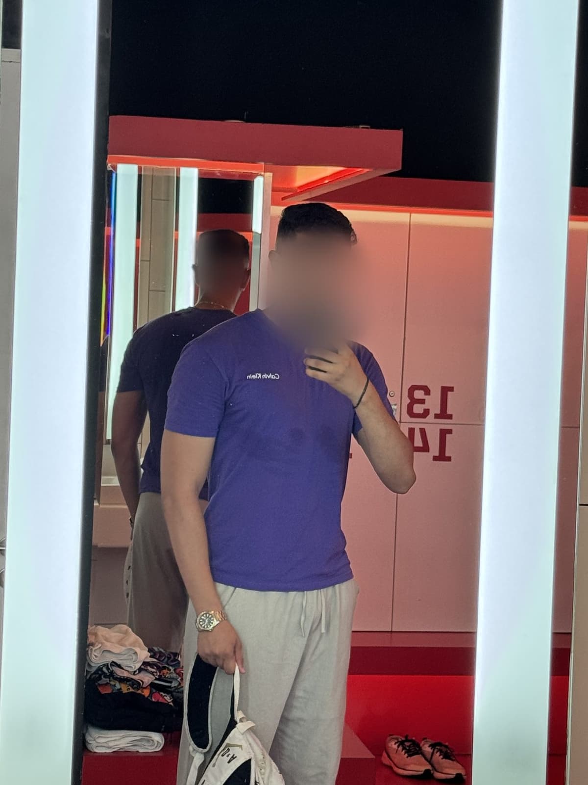 Mehdi in a fitted purple t-shirt, mirror photo