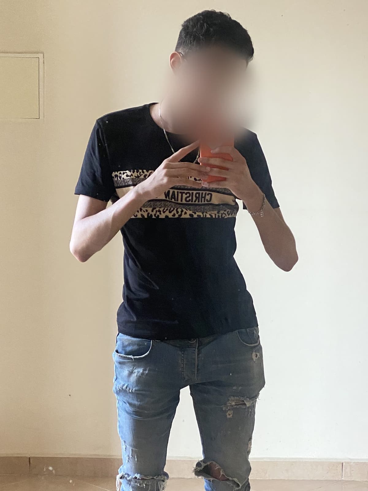 Mehdi before, a designer t-shirt hanging off a very thin frame, loose jeans